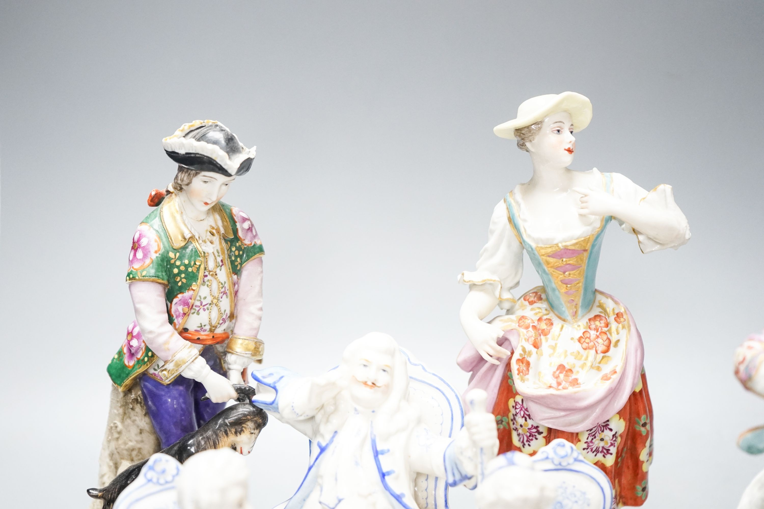 A Sitzendorf group of a Shepherd and shepherdess, three other Continental costume figures and a group (5) 27cm